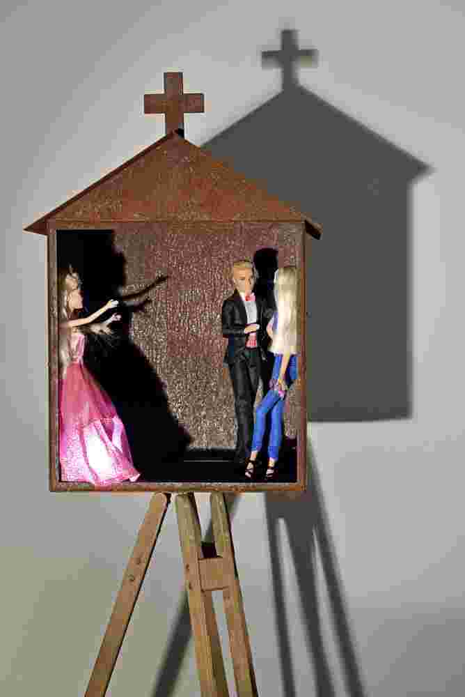 Mixed media art resembling small shrines made of rusted stee, barbies and toys. Related to the themes of vanity and religion.