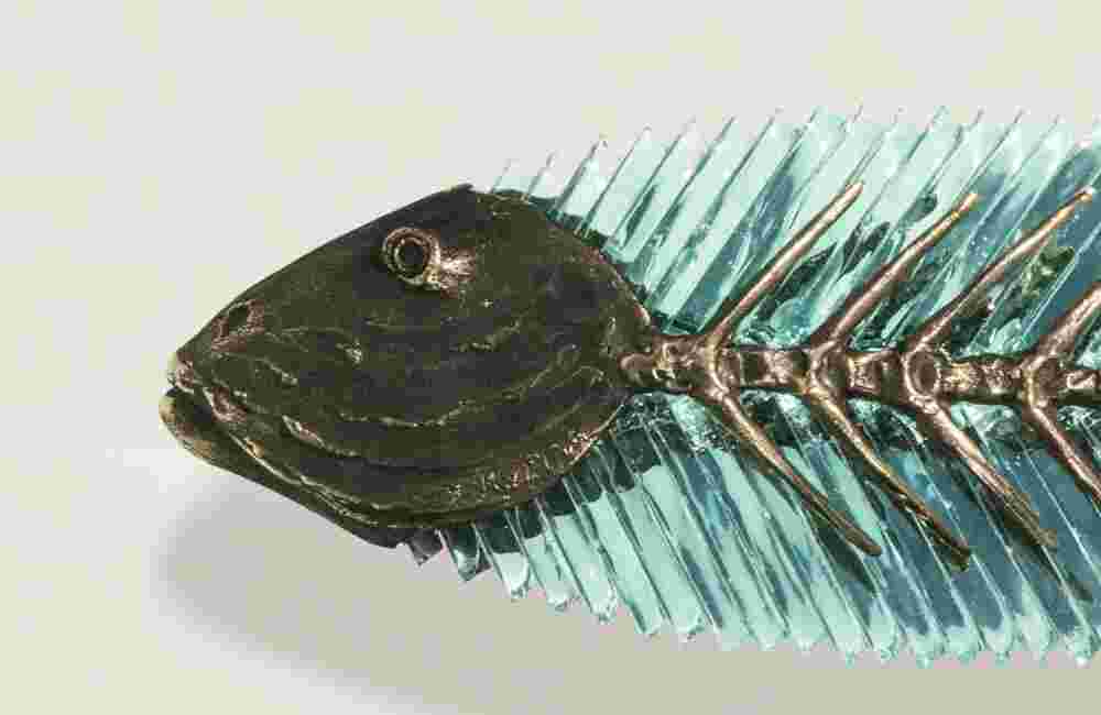Cast bronze & glass sculpture of a fish. “Frozen Fish” collection