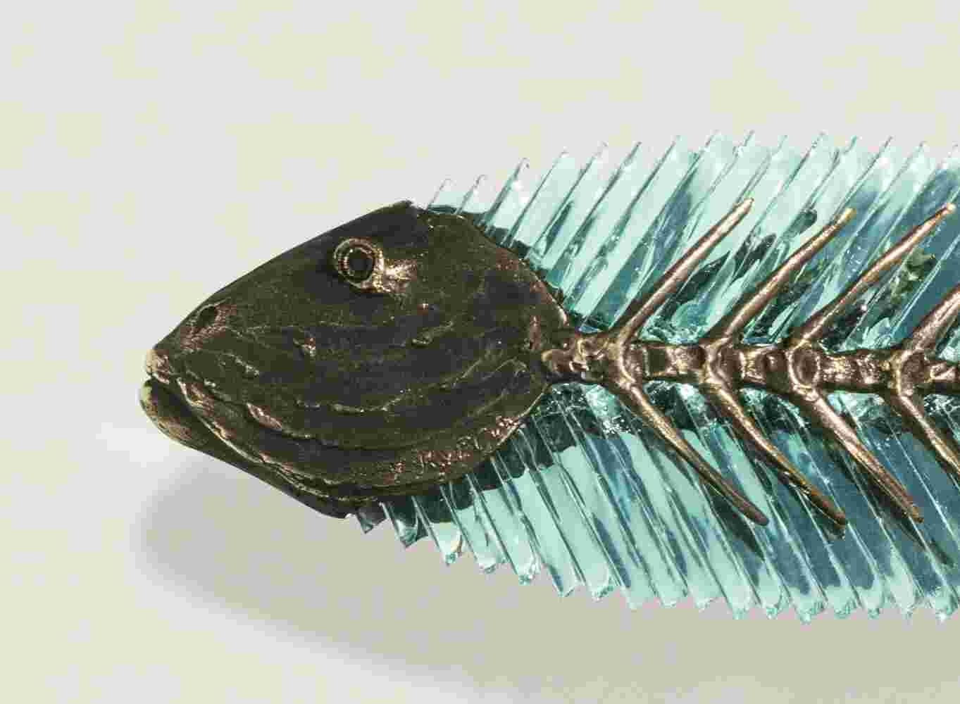 Cast bronze & glass sculpture of a fish. “Frozen Fish” collection
