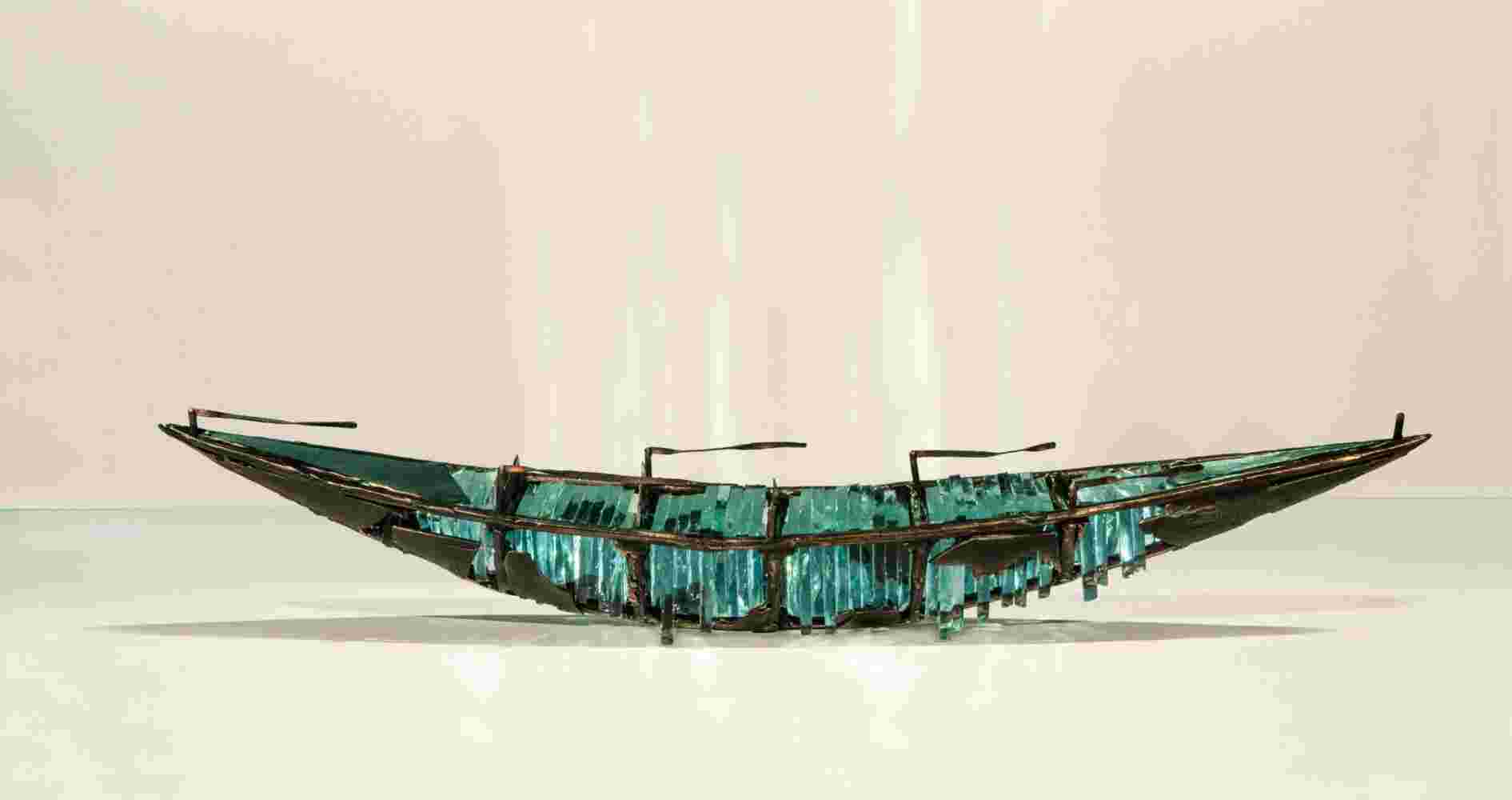 hipwreck boat sculpture made of hand cut glass and bronze.
