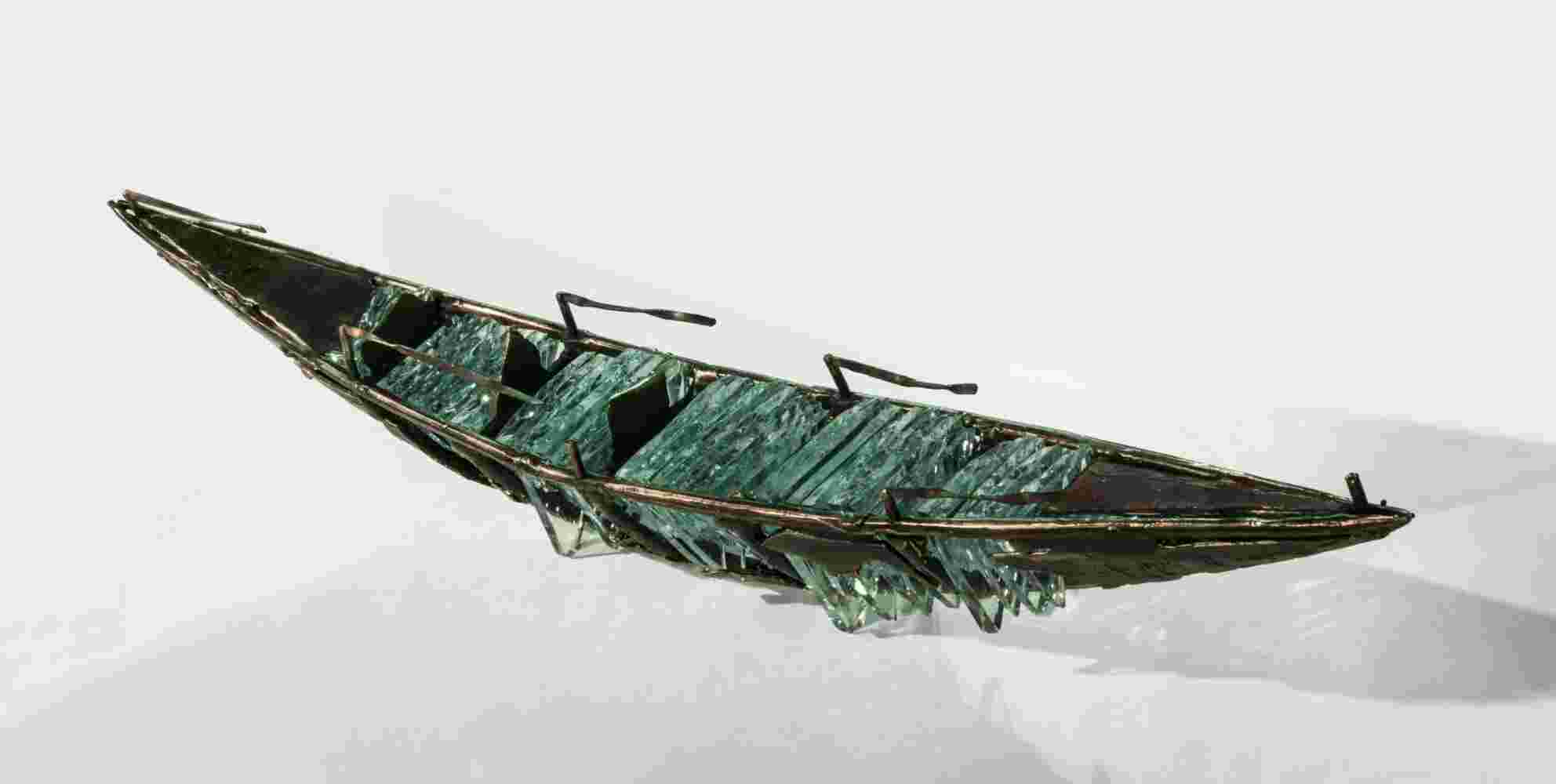 hipwreck boat sculpture made of hand cut glass and bronze.