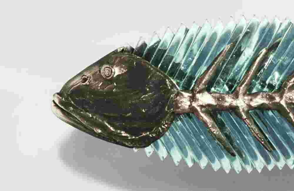 Cast bronze & glass sculpture of a fish. “Frozen Fish”.