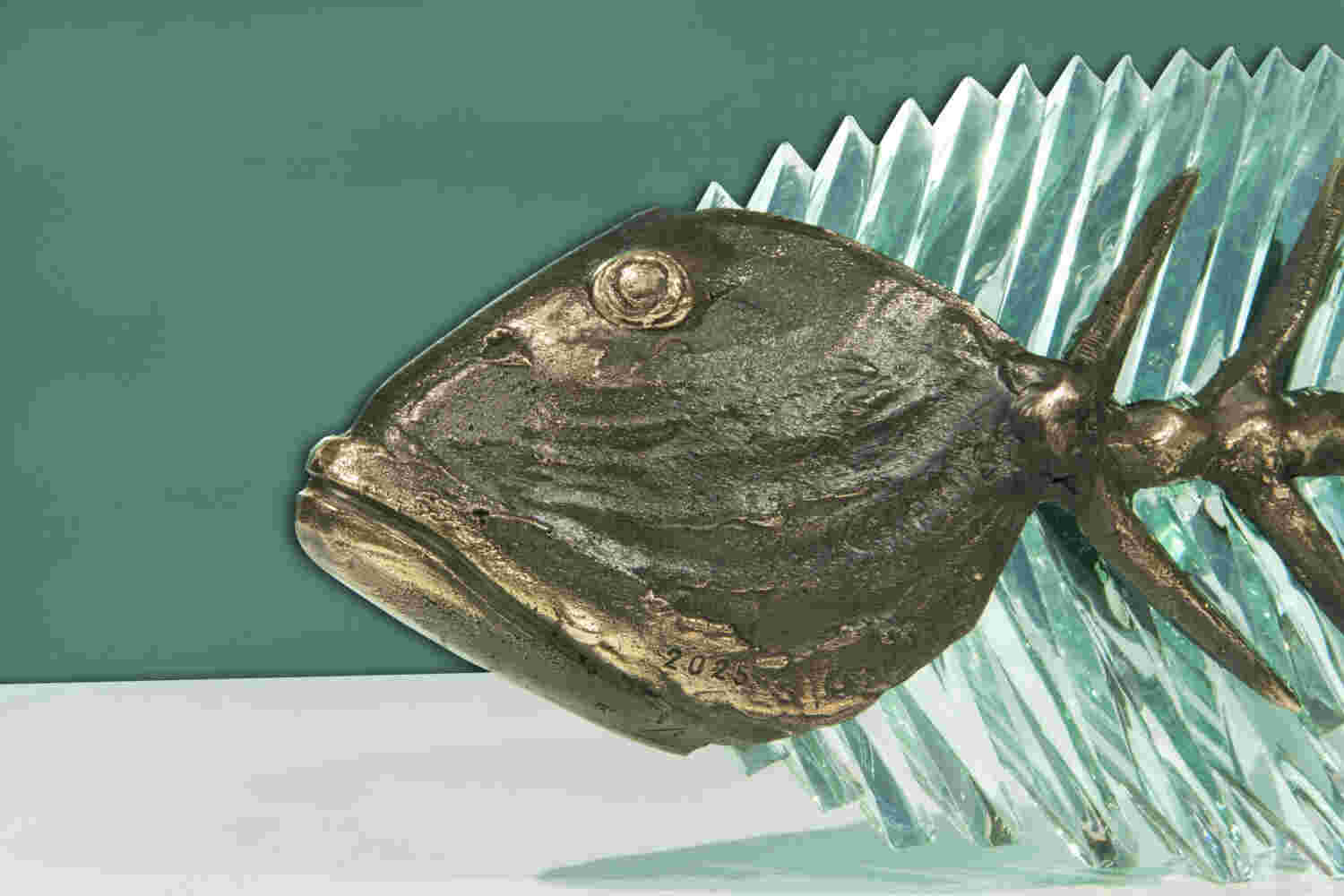 Cast bronze & glass sculpture of a fish. “Frozen Fish”.