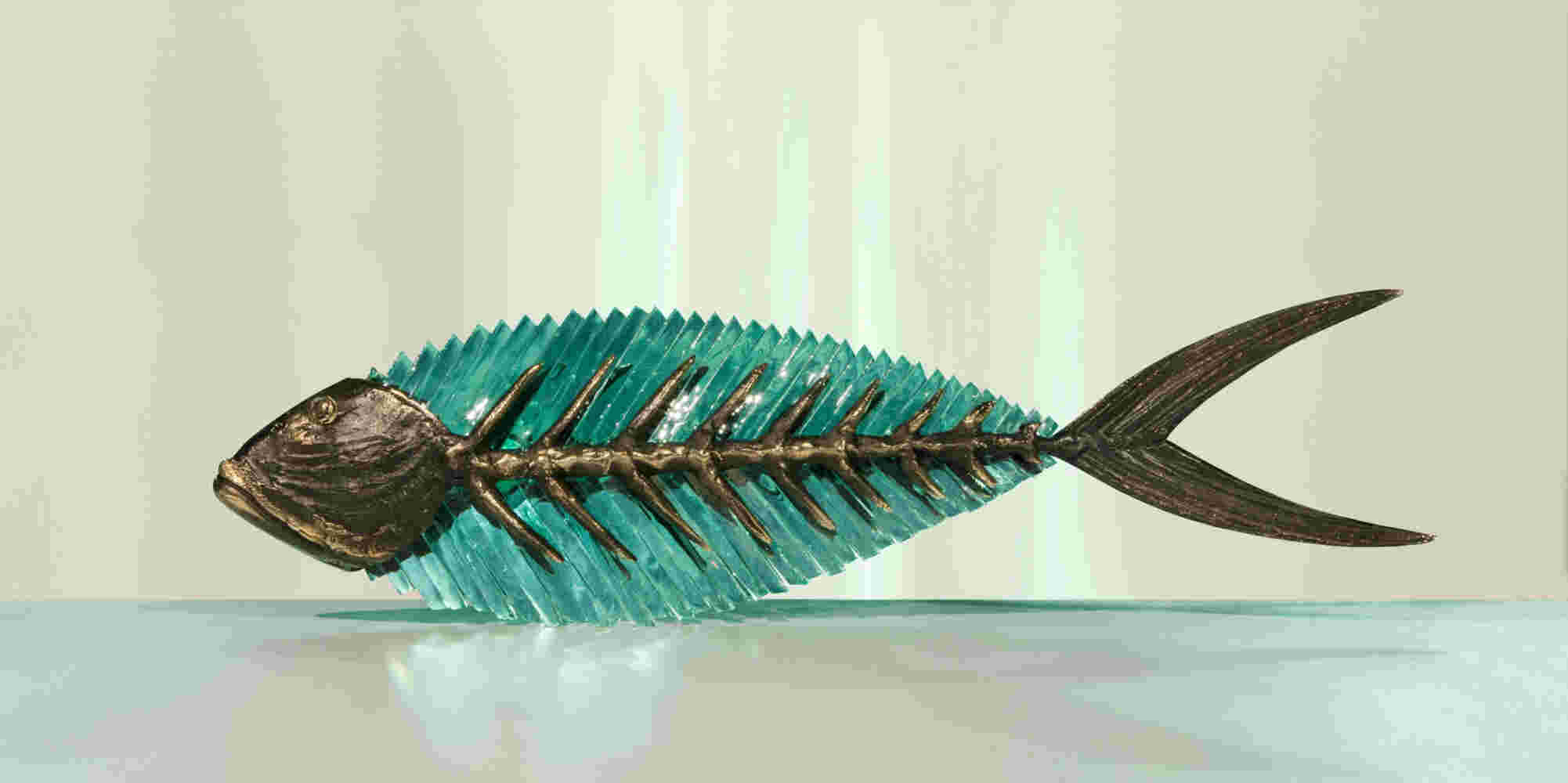 Cast bronze & glass sculpture of a fish. “Frozen Fish”.