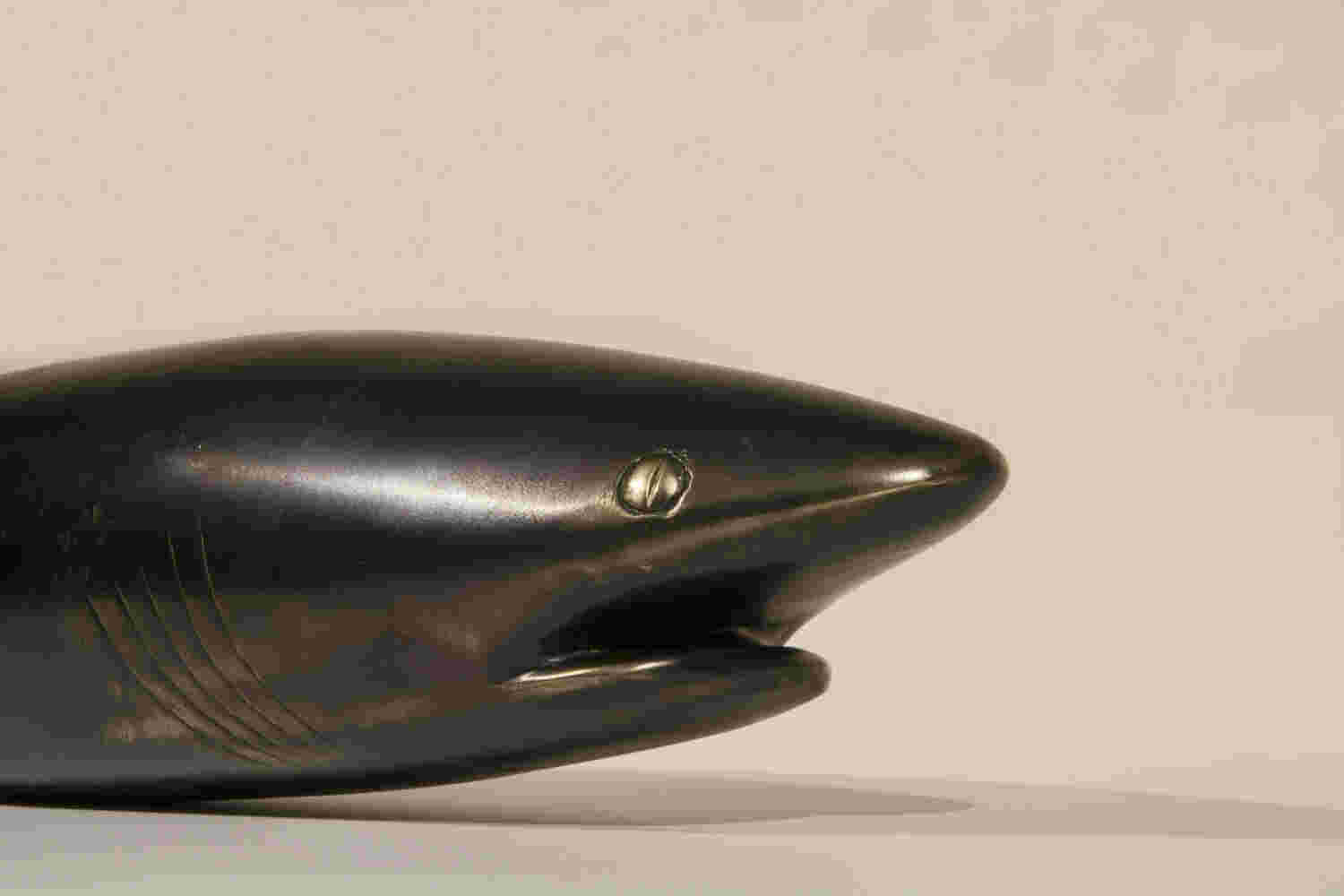 Surrealistic bronze black patina sculpture, half dolphin, half shark