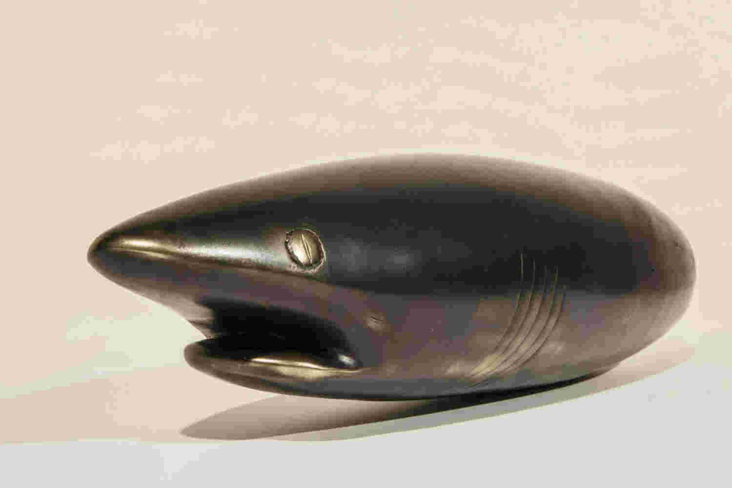 Surrealistic bronze black patina sculpture, half dolphin, half shark