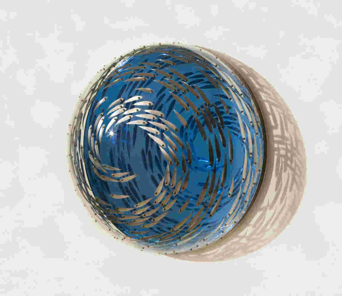 Acrylic hemisphere with metallic fish create a swirling effect that resembles underwater shoals - ⌀70x35cm.