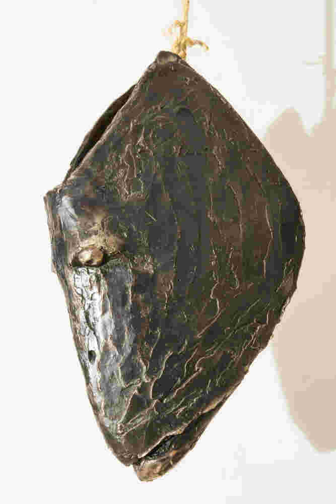 Three cast bronze hanging fish heads installation