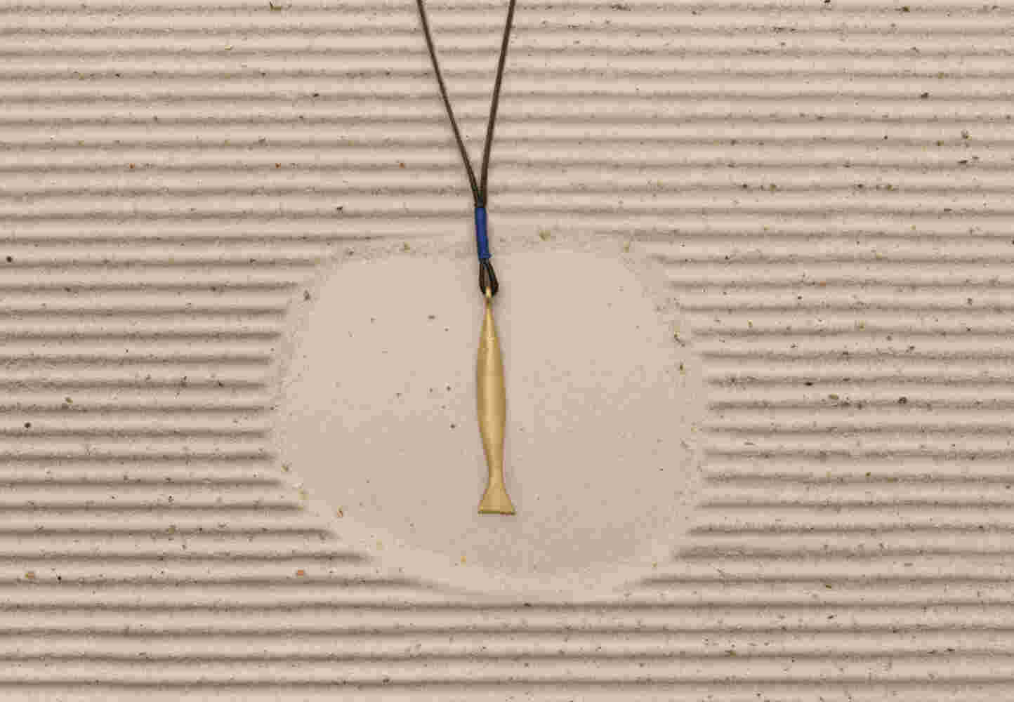 Gold etched fish with cord (LRG)