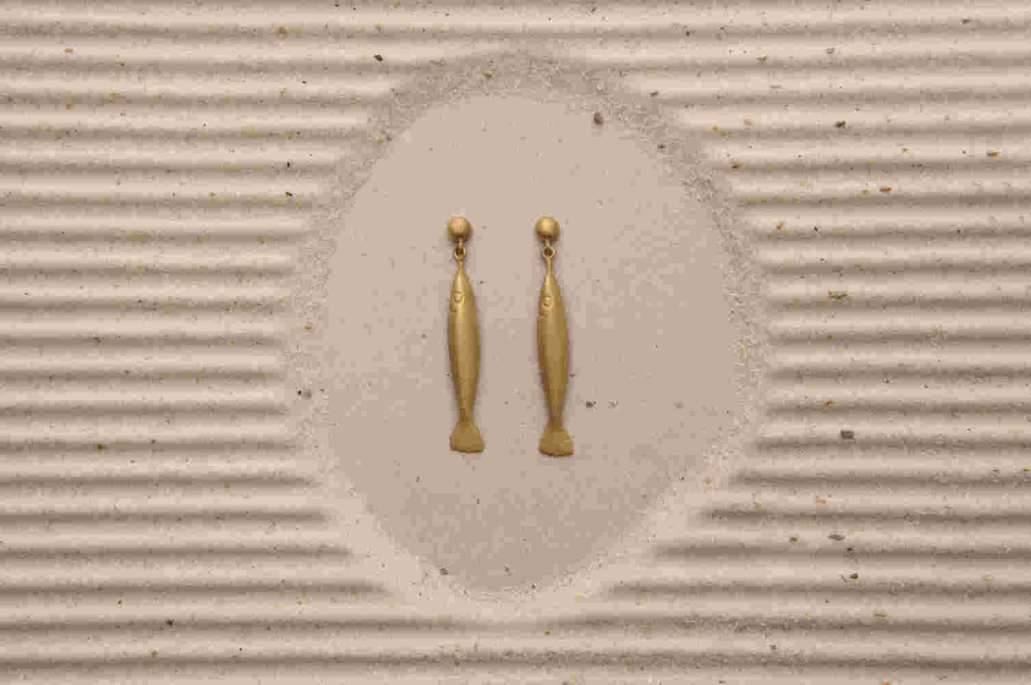 Gold etched fish earrings