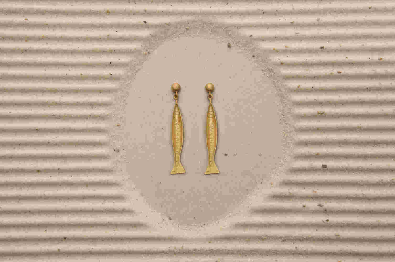 Gold etched fish earrings