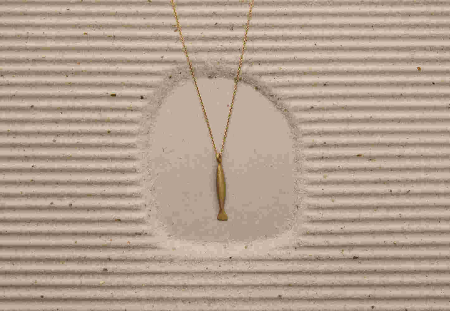 Gold etched fish with chain