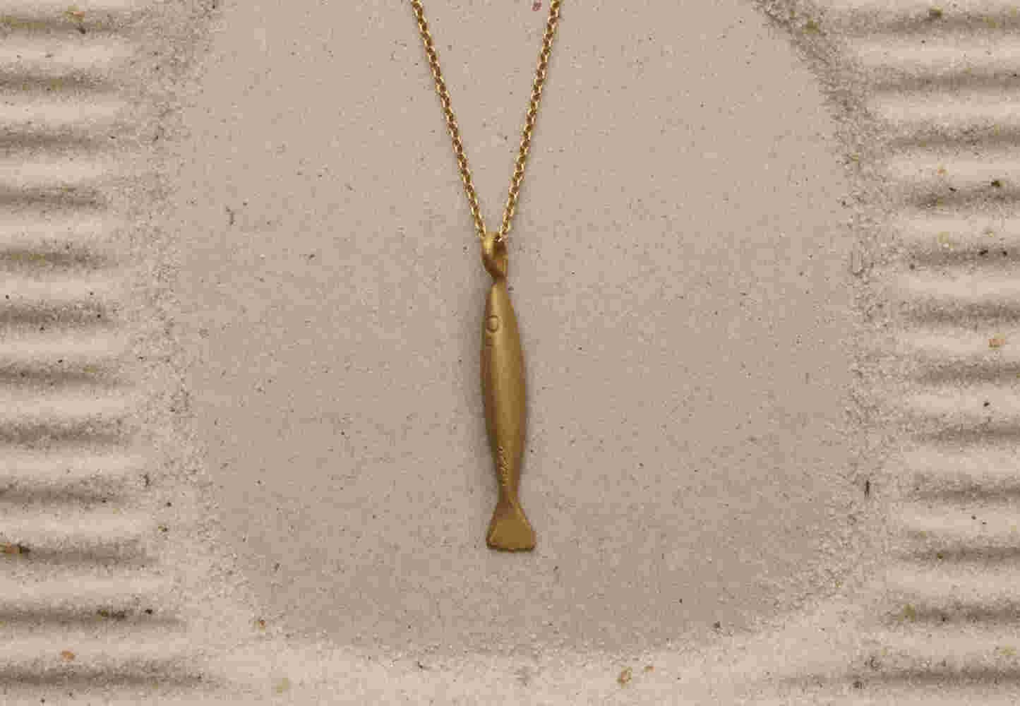 Gold etched fish with chain