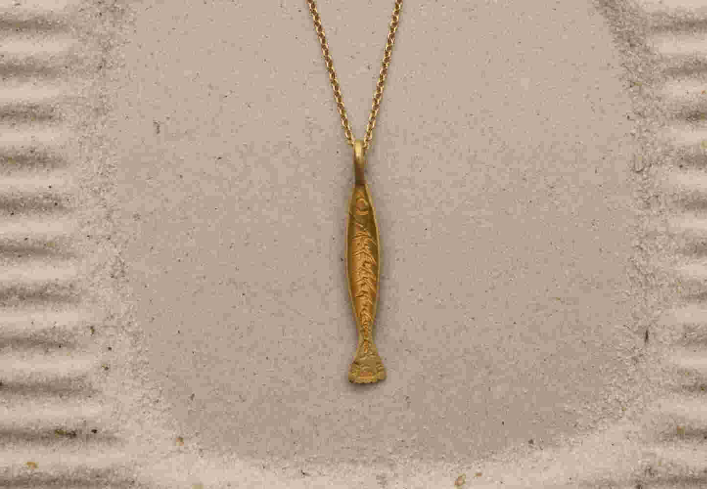 Gold etched fish with chain