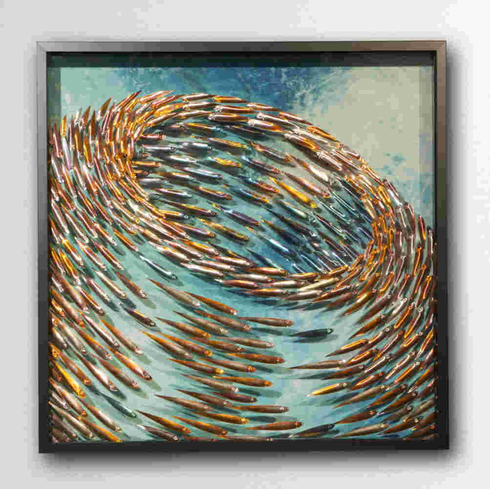 Three-dimensional wall sculpture, school of fish theme, with layers of plexiglass, aluminum frame and swirling copper fish.