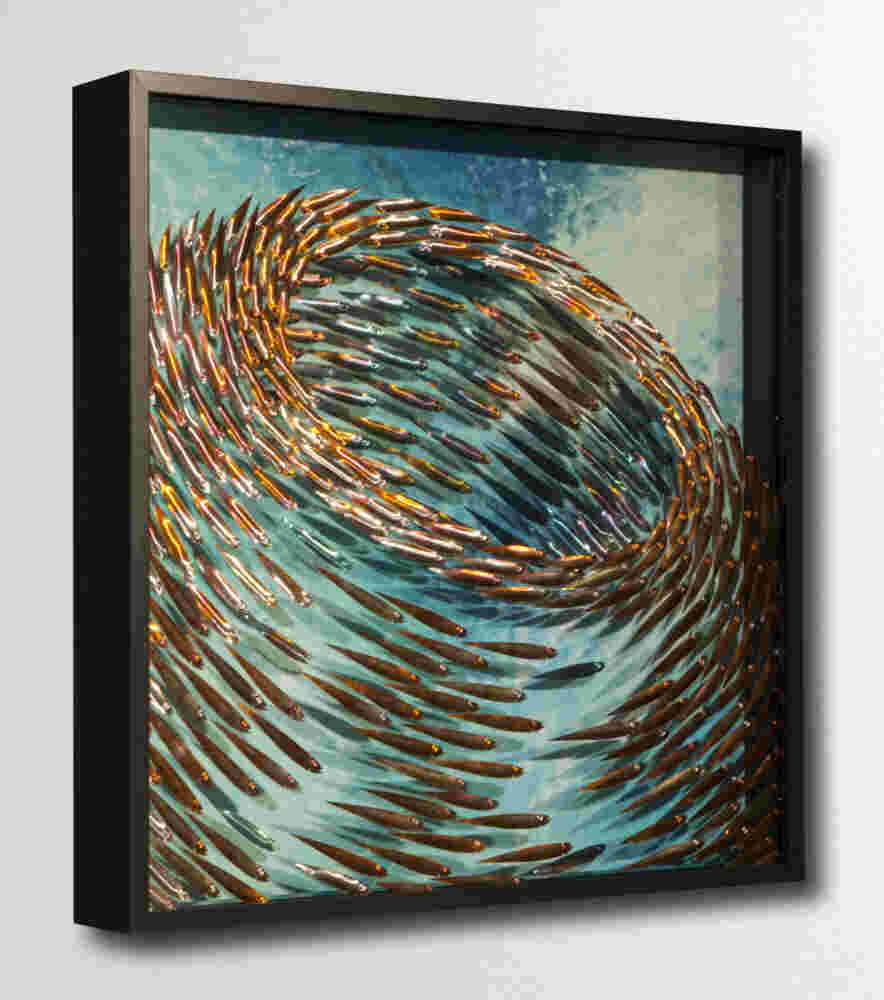Three-dimensional wall sculpture, school of fish theme, with layers of plexiglass, aluminum frame and swirling copper fish.