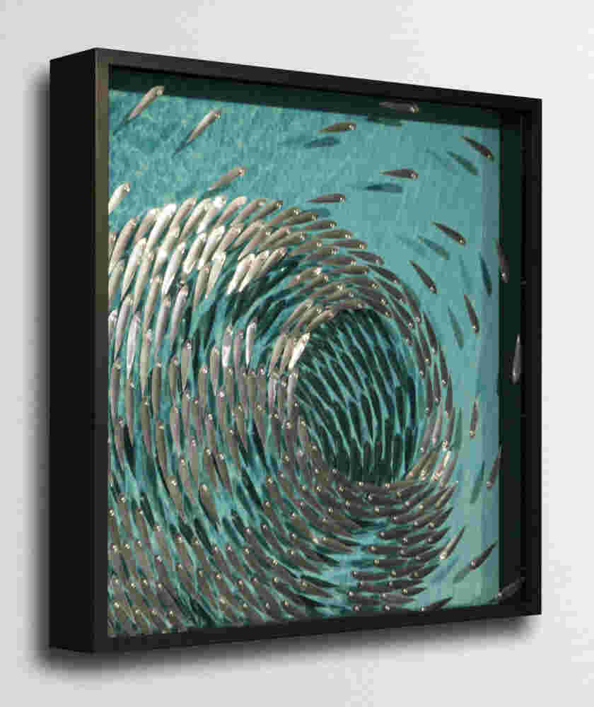 Three-dimensional wall sculpture, school of fish theme, with layers of plexiglass, aluminum frame and swirling copper fish.