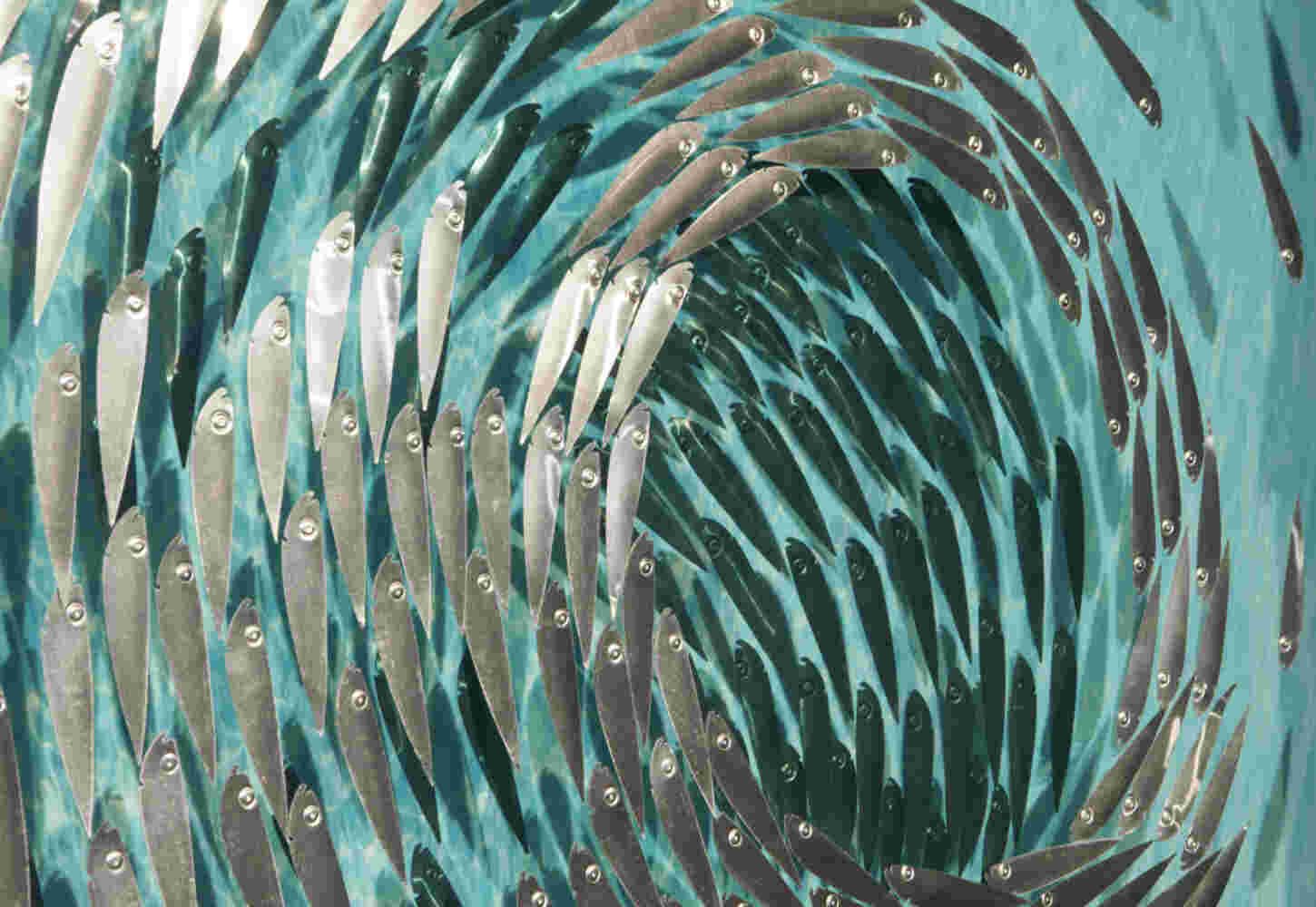 Three-dimensional wall sculpture, school of fish theme, with layers of plexiglass, aluminum frame and swirling copper fish.