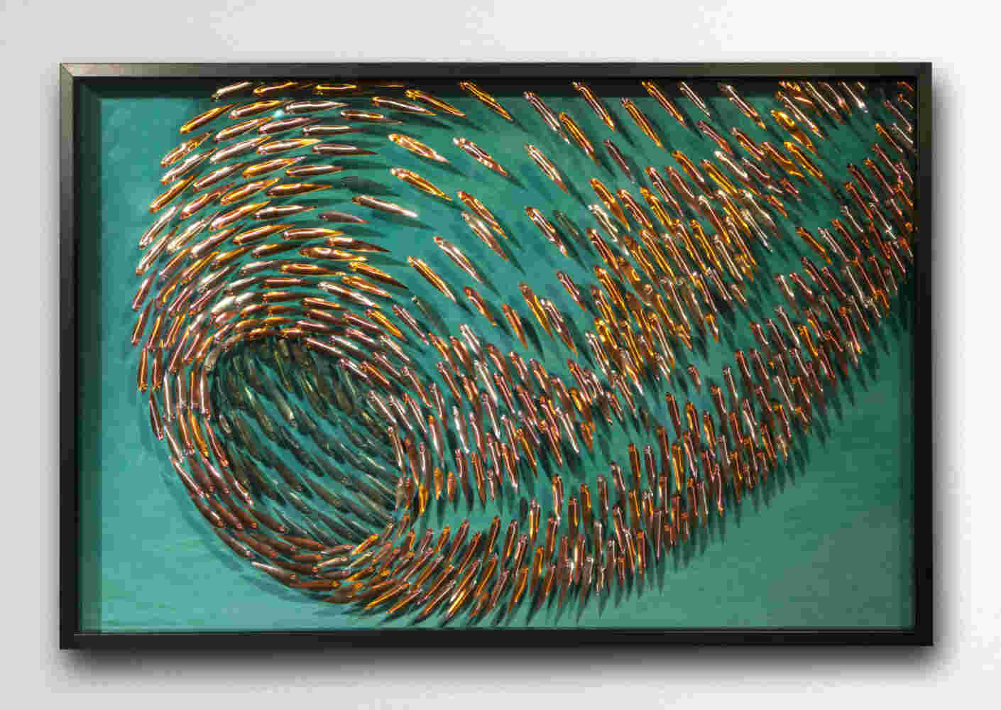 Three-dimensional wall sculpture, school of fish theme, with layers of plexiglass, aluminum frame and swirling copper fish.