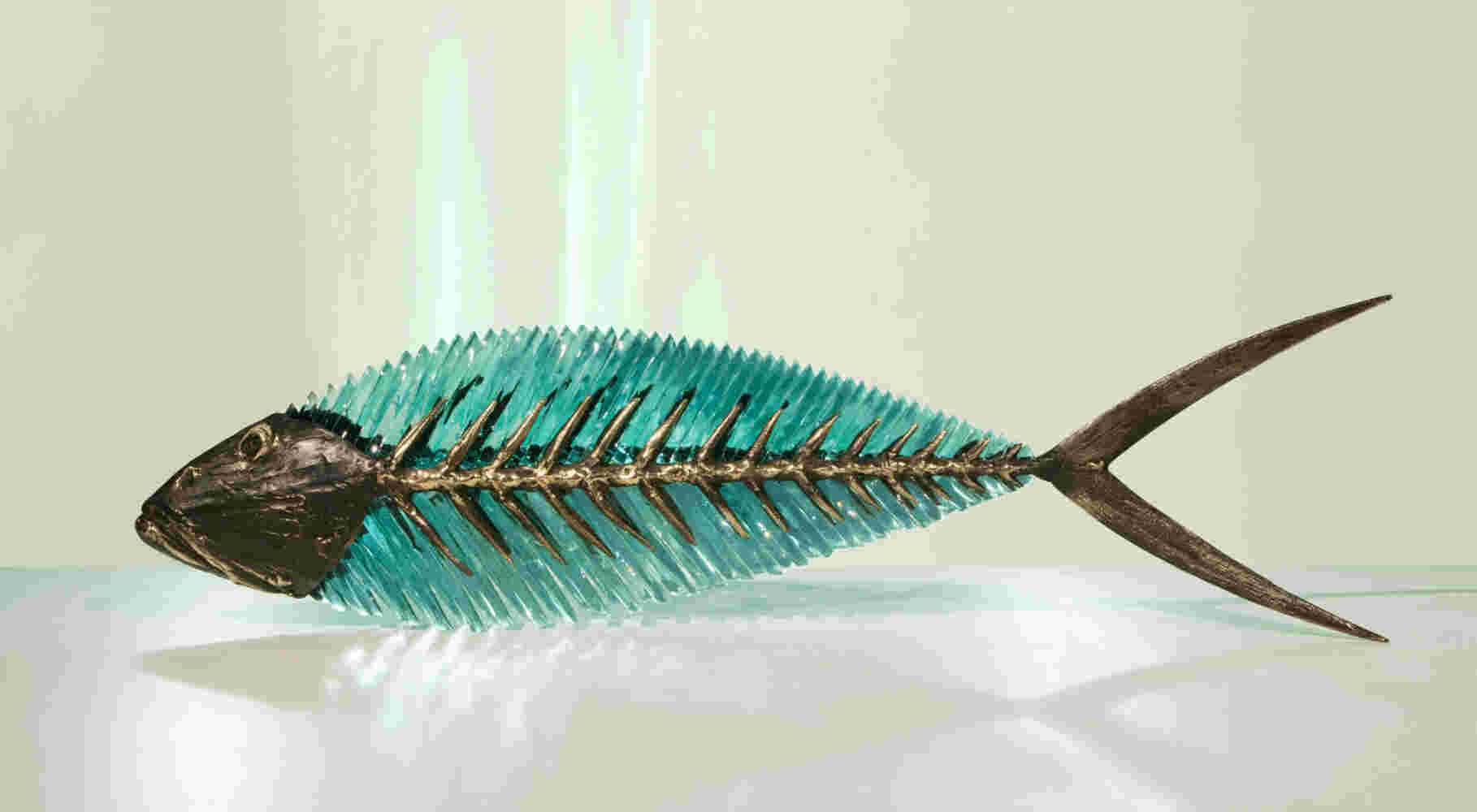 Cast bronze & glass sculpture of a fish. “Frozen Fish”.