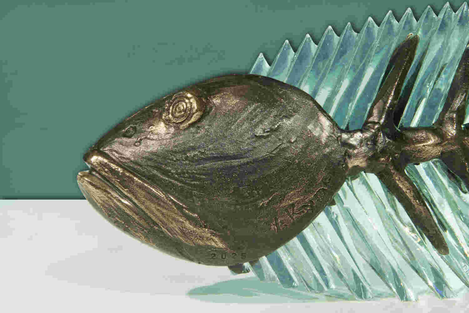 Cast bronze & glass sculpture of a fish. “Frozen Fish”.