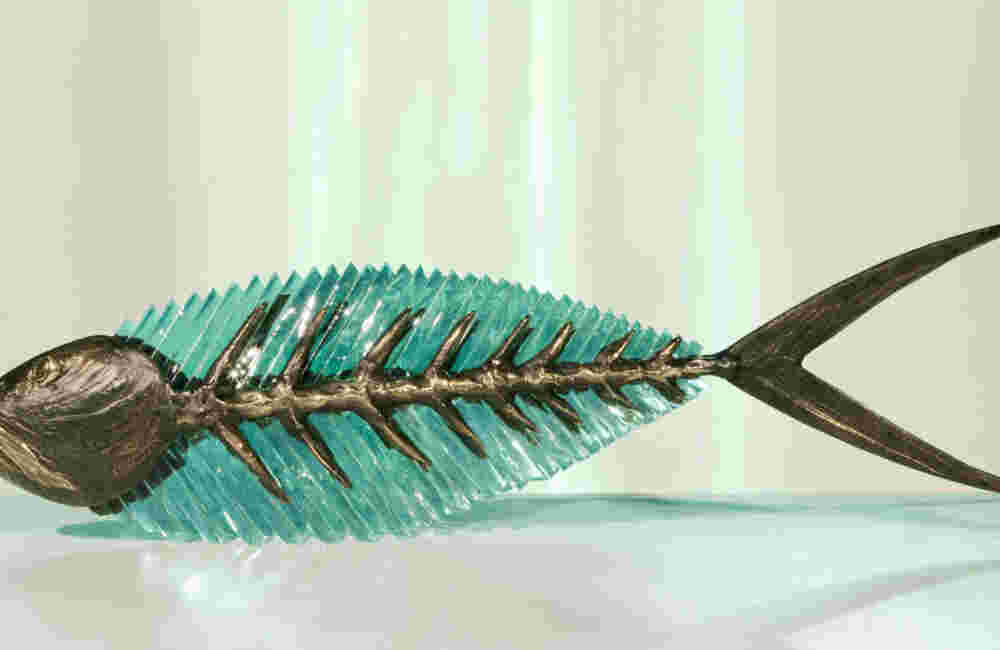 Cast bronze & glass sculpture of a fish. “Frozen Fish”.