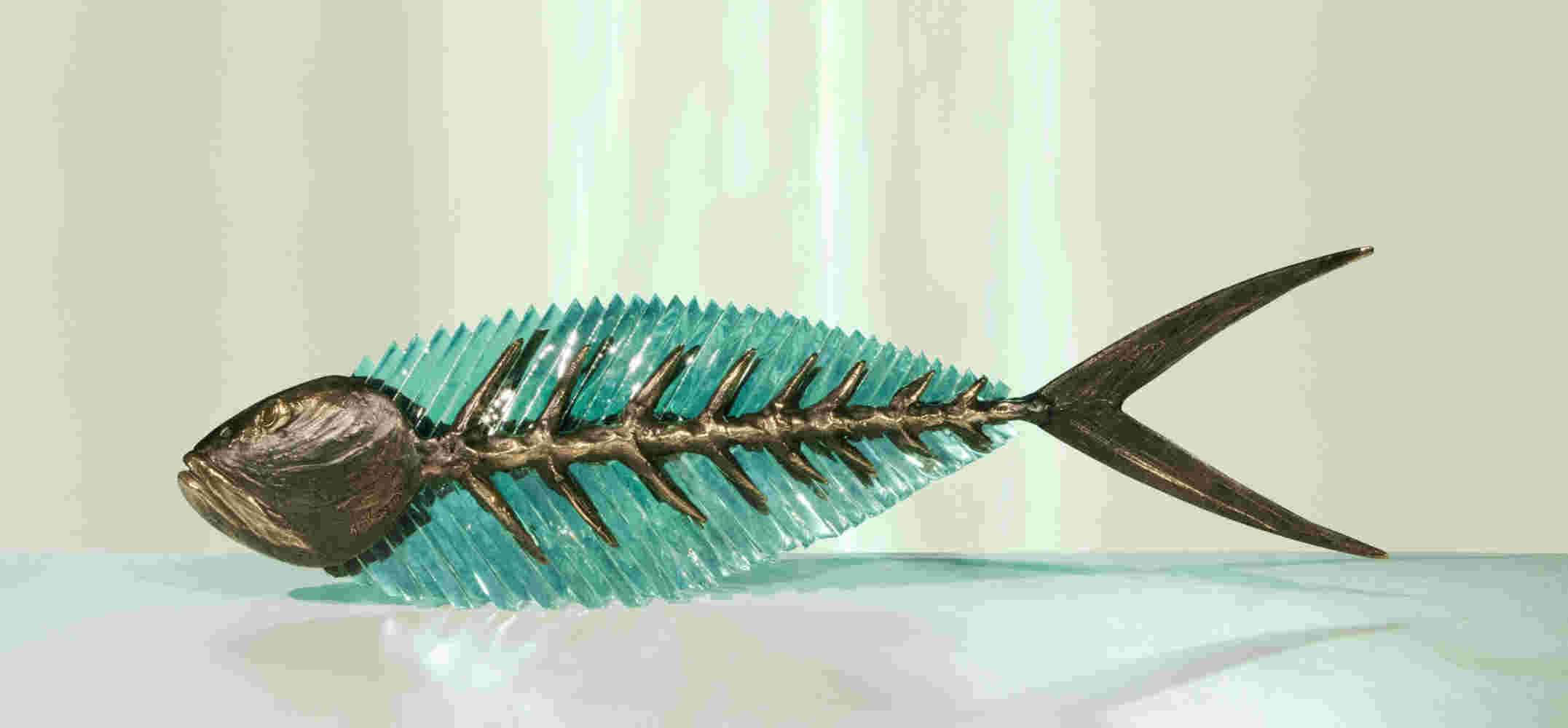 Cast bronze & glass sculpture of a fish. “Frozen Fish”.