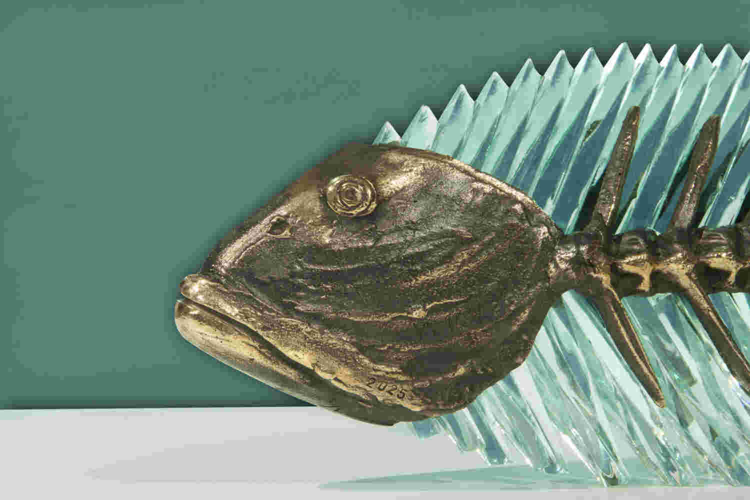 Cast bronze & glass sculpture of a fish. “Frozen Fish”.