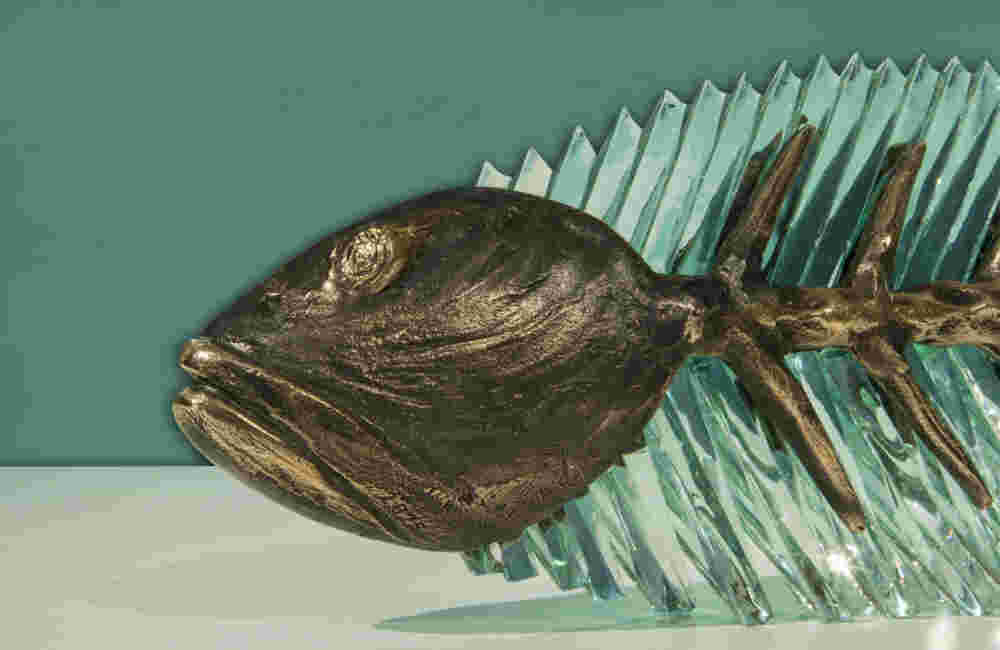 Cast bronze & glass sculpture of a fish. “Frozen Fish”.