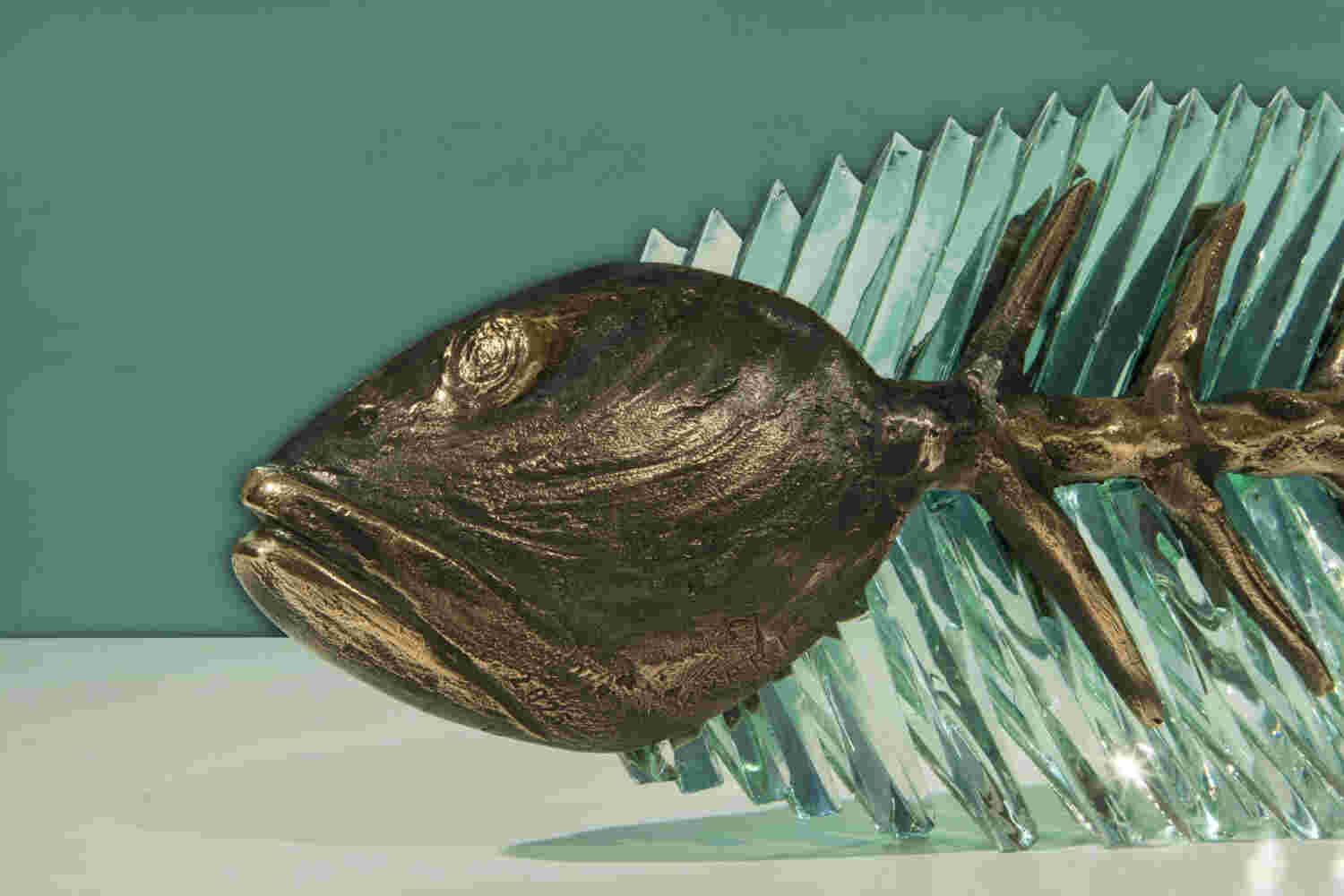 Cast bronze & glass sculpture of a fish. “Frozen Fish”.