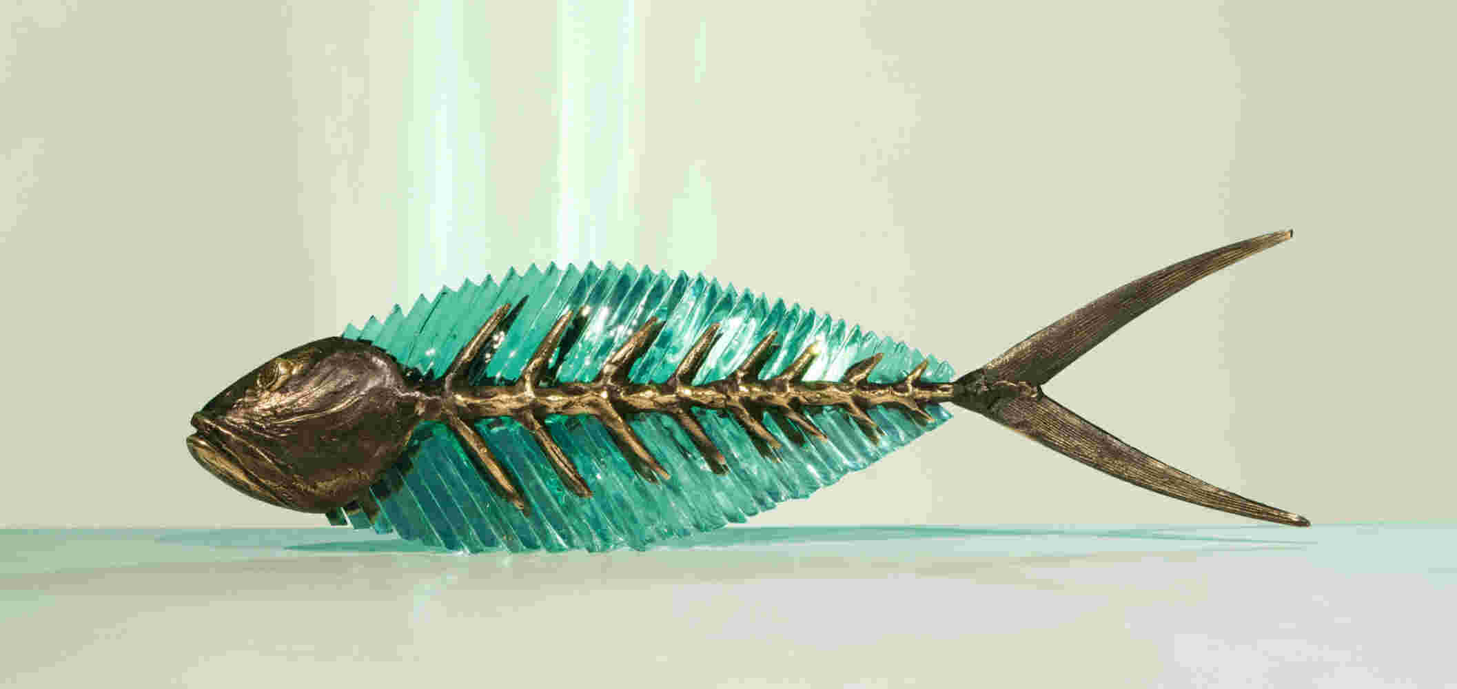 Cast bronze & glass sculpture of a fish. “Frozen Fish”.