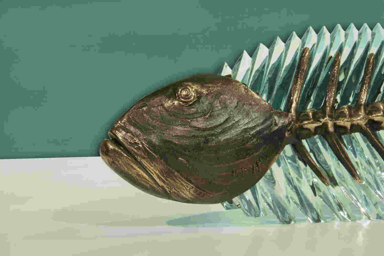 Cast bronze & glass sculpture of a fish. “Frozen Fish”.
