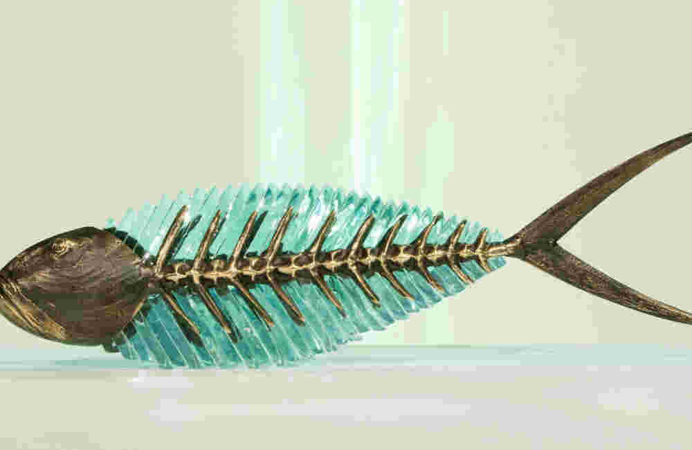 Cast bronze & glass sculpture of a fish. “Frozen Fish”.