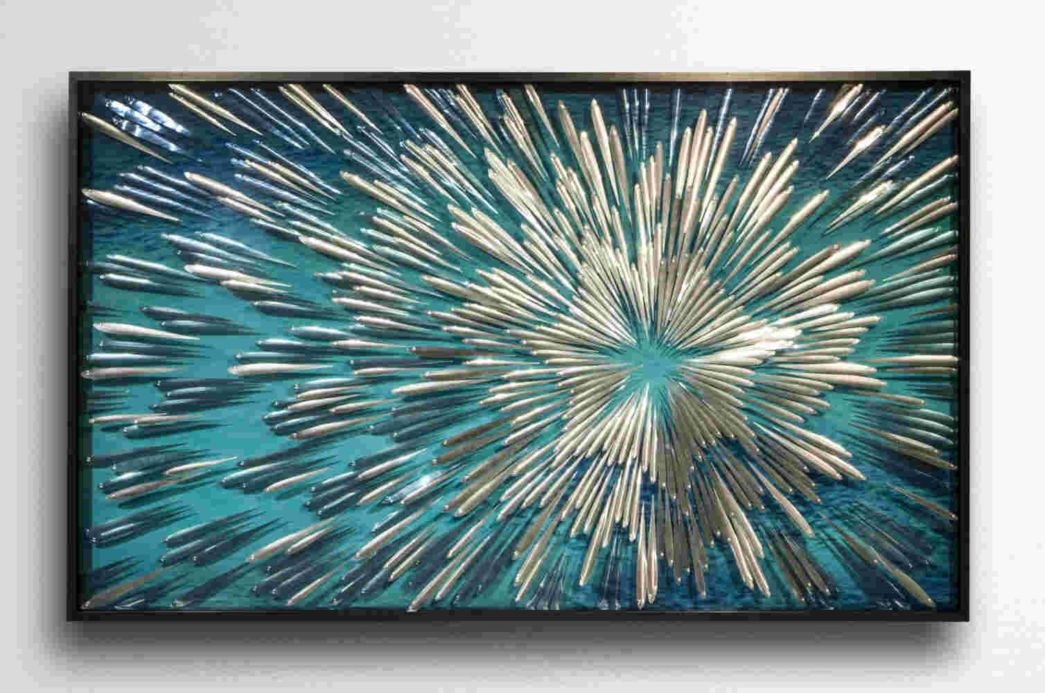 Three-dimensional wall sculpture, school of fish theme, with layers of plexiglass, aluminum frame and swirling copper fish.