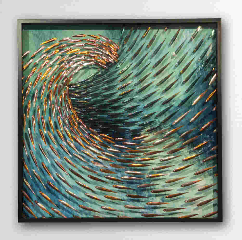 Three-dimensional wall sculpture, school of fish theme, with layers of plexiglass, aluminum frame and swirling copper fish.