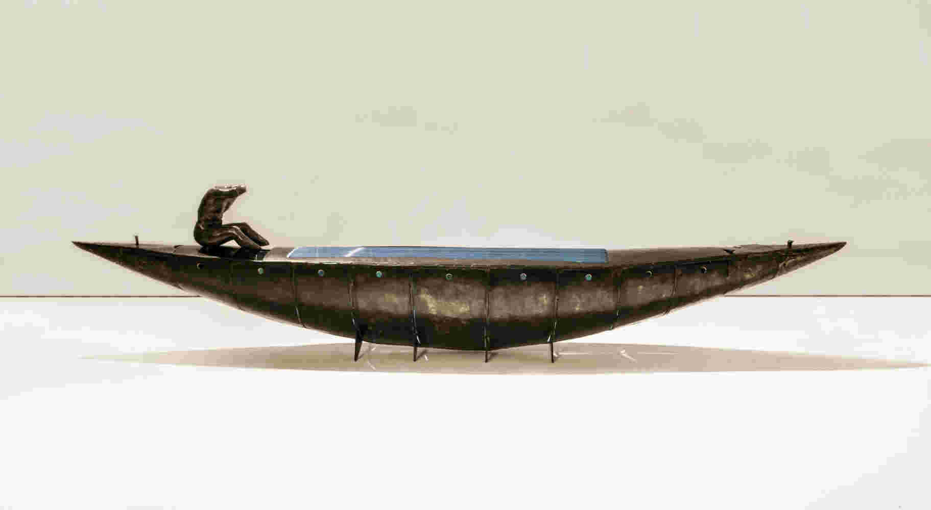 Boat sculpture made of cast bronze.