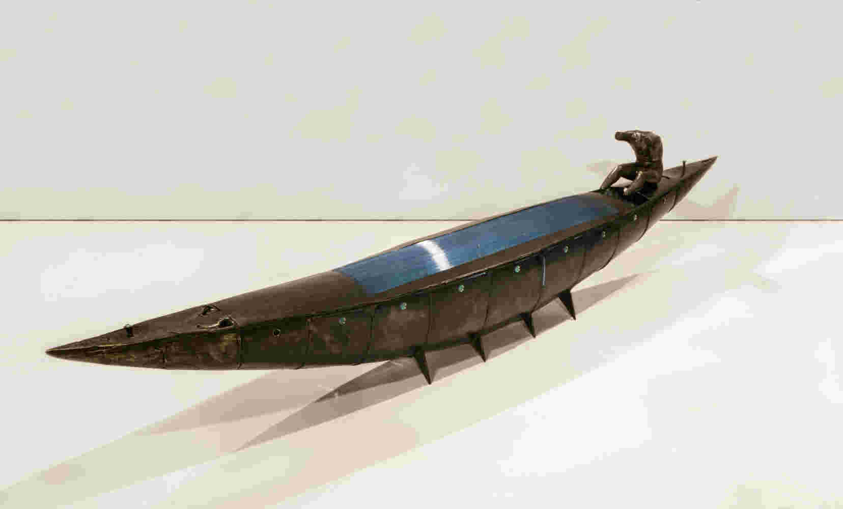 Boat sculpture made of cast bronze.