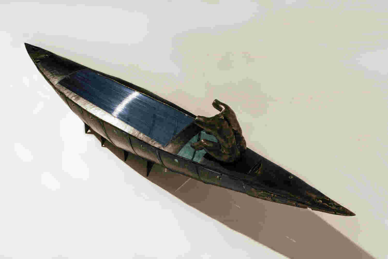 Boat sculpture made of cast bronze.