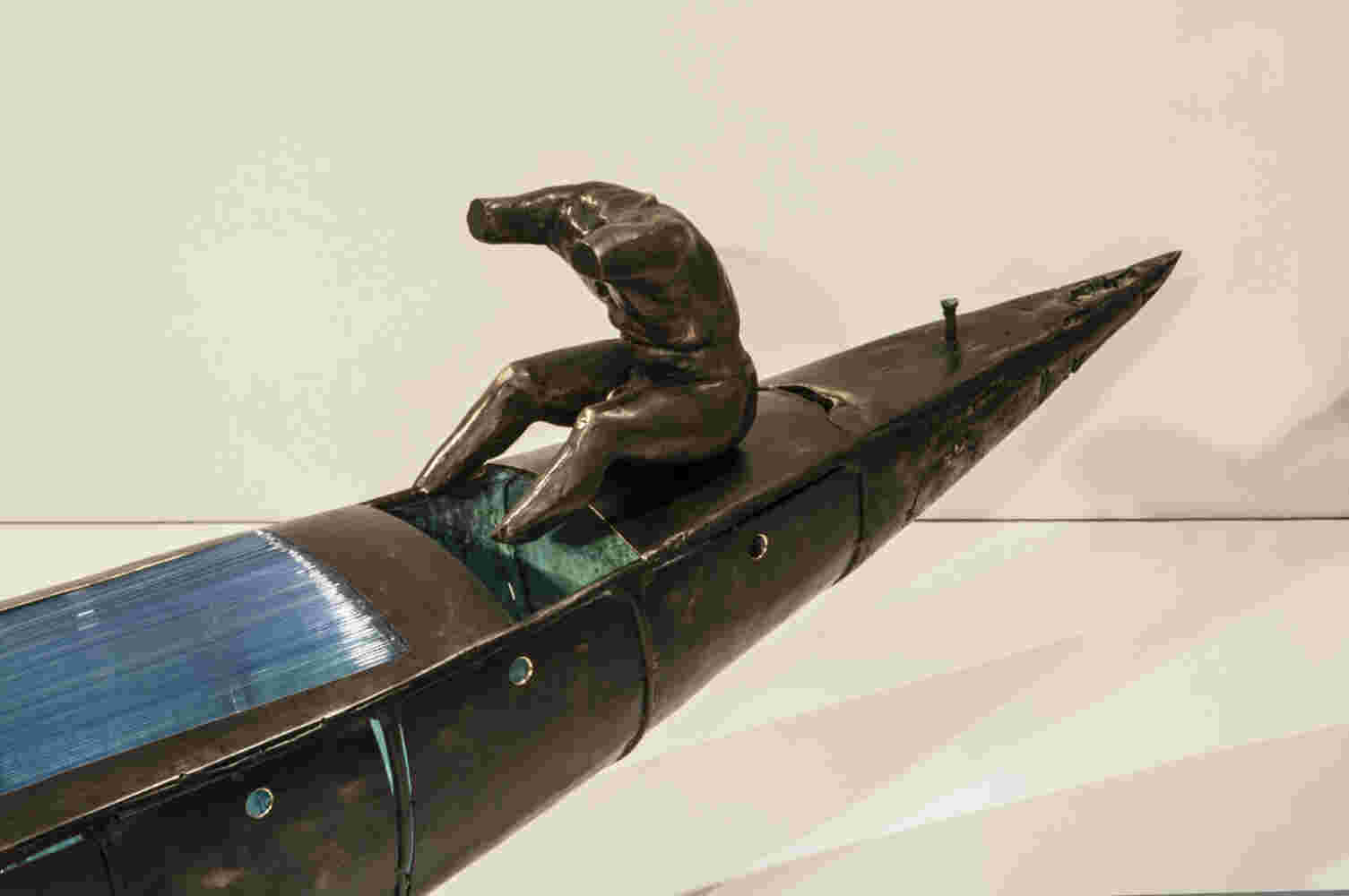 Boat sculpture made of cast bronze.