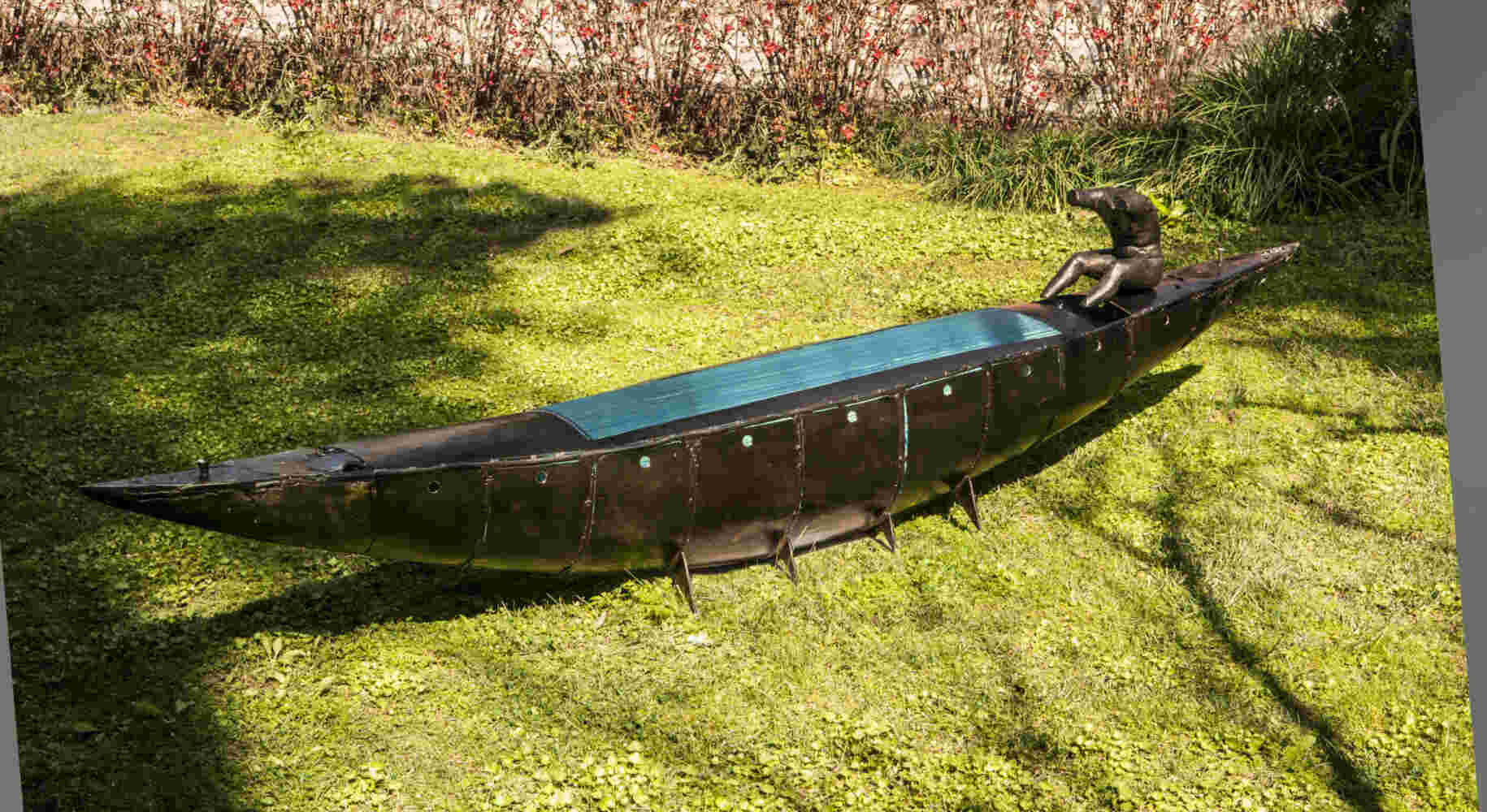 Boat sculpture made of cast bronze.