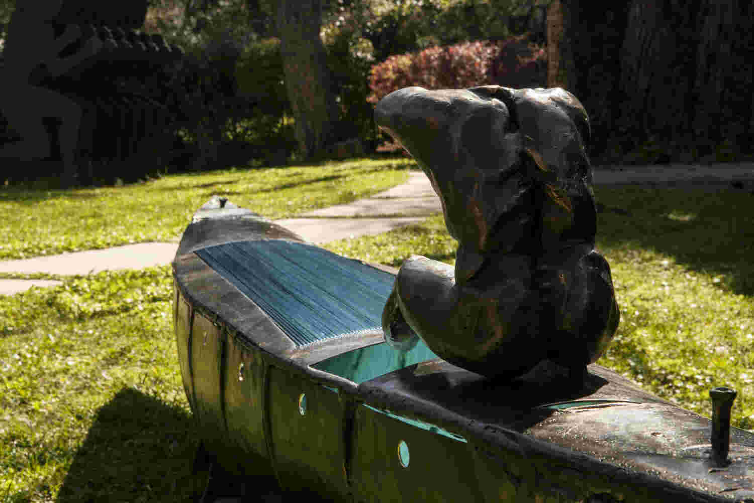 Boat sculpture made of cast bronze.