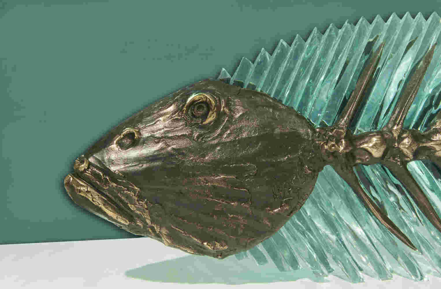 Cast bronze & glass sculpture of a fish. “Frozen Fish”.