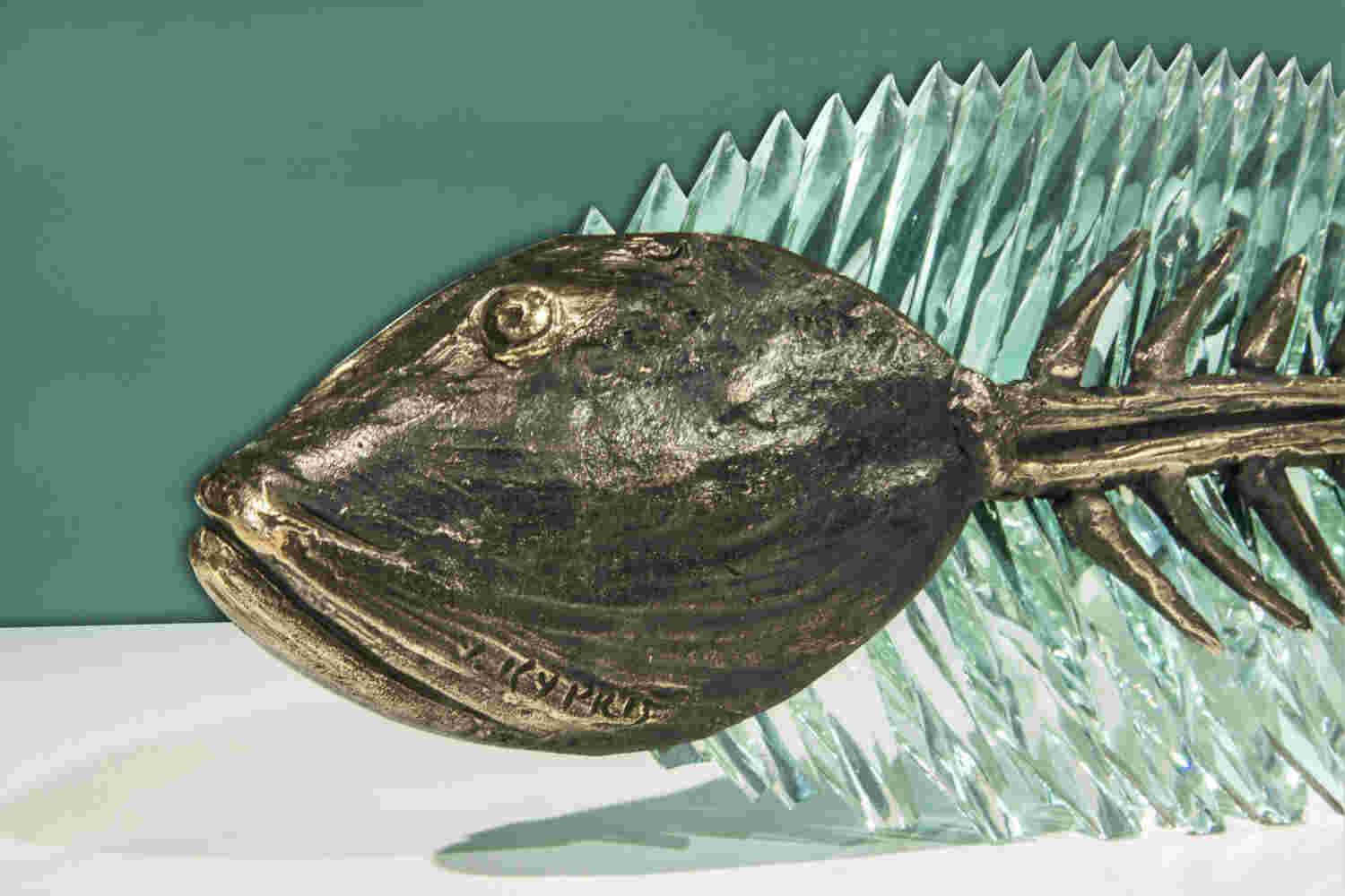 Cast bronze & glass sculpture of a fish. “Frozen Fish”.