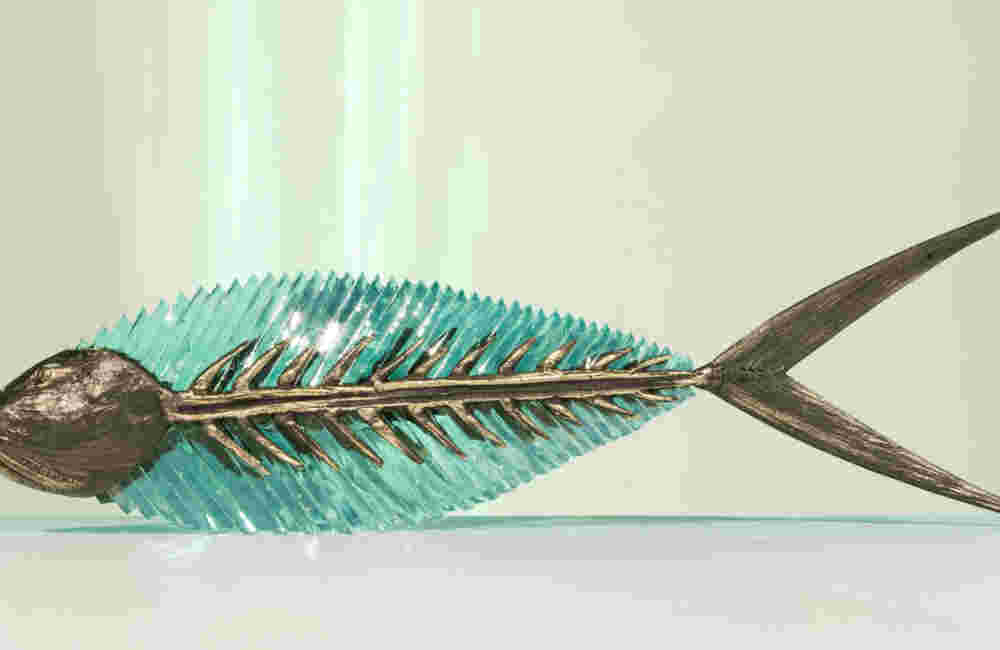 Cast bronze & glass sculpture of a fish. “Frozen Fish”.