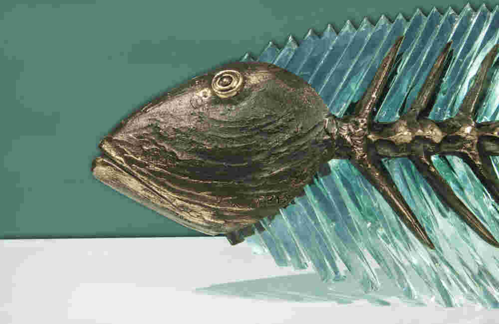 Cast bronze & glass sculpture of a fish. “Frozen Fish”.