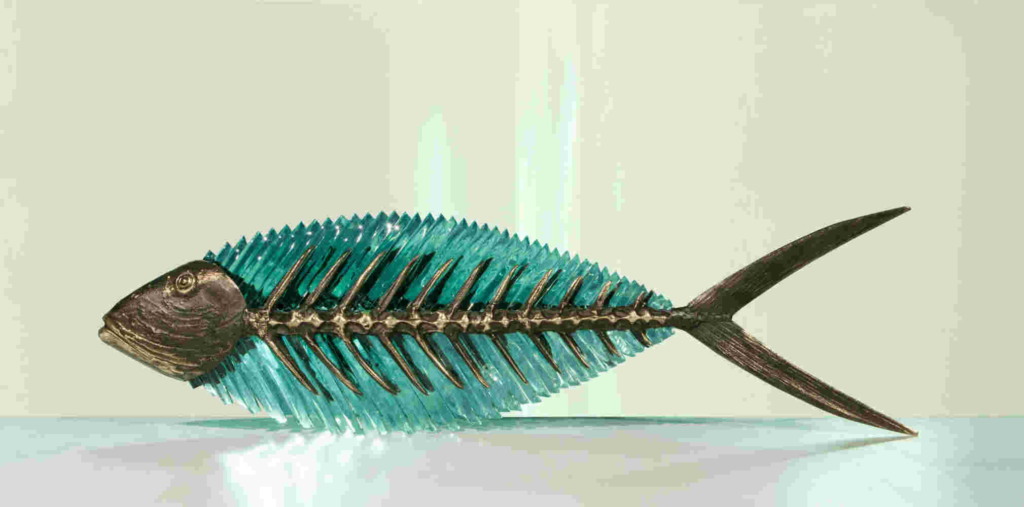 Cast bronze & glass sculpture of a fish. “Frozen Fish”.