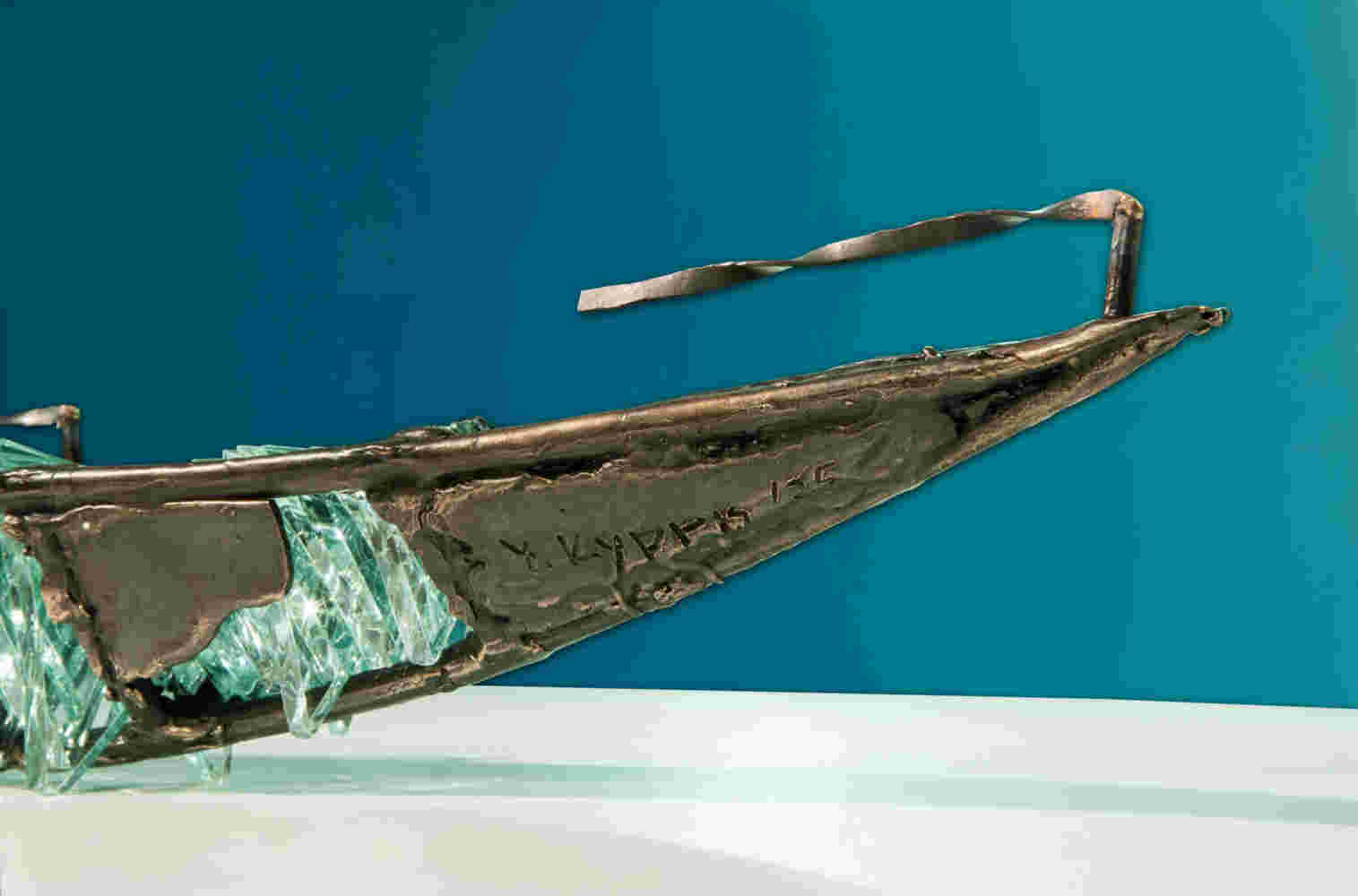 Shipwreck boat sculpture made of hand cut glass and bronze.