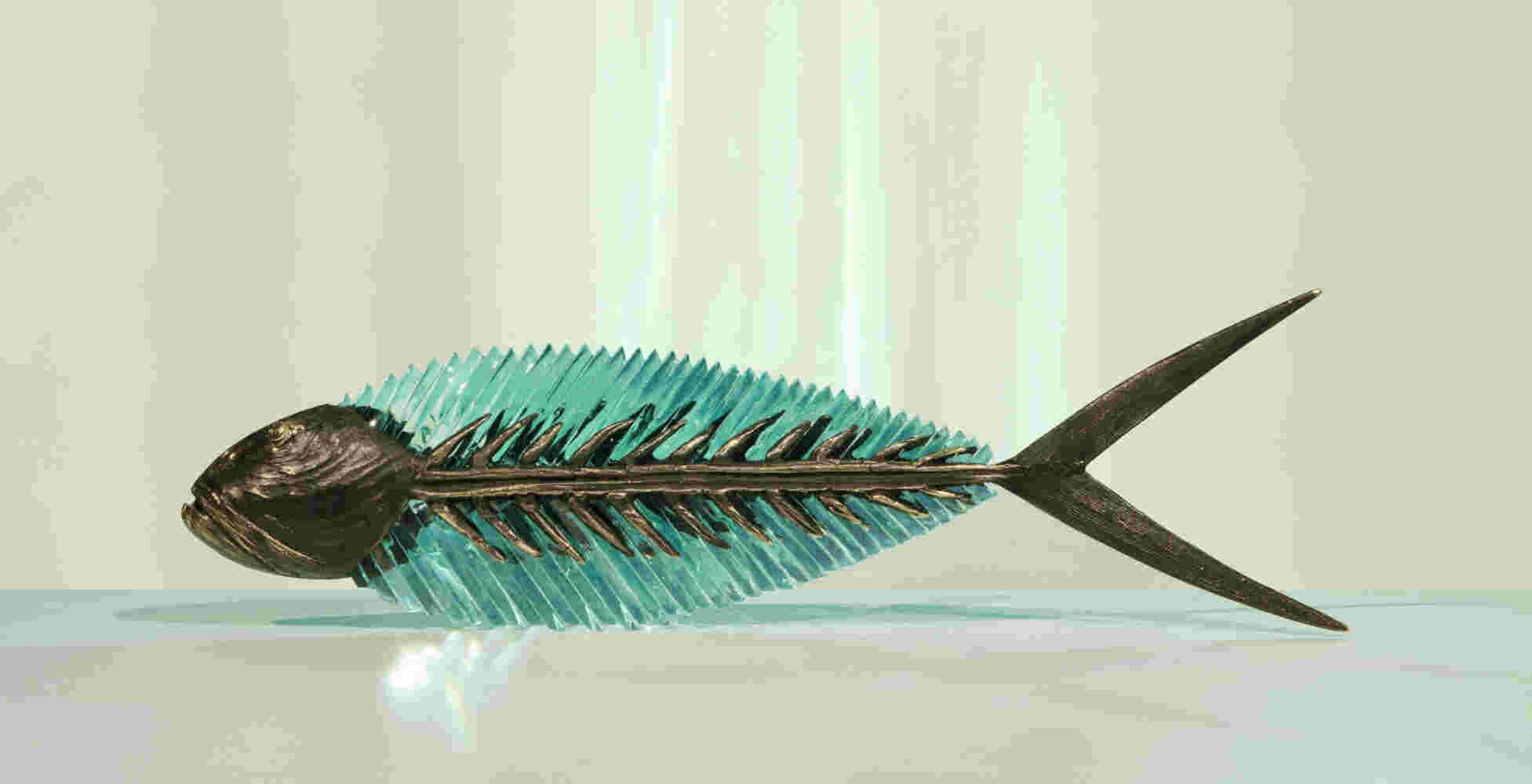 Cast bronze & glass sculpture of a fish. “Frozen Fish”.