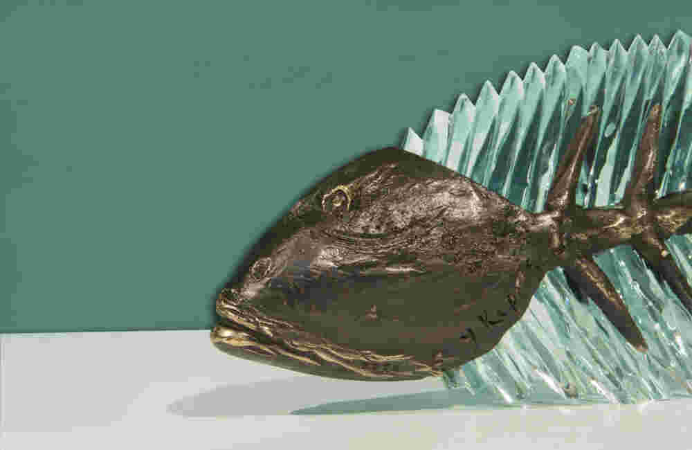 Cast bronze & glass sculpture of a fish. “Frozen Fish”.