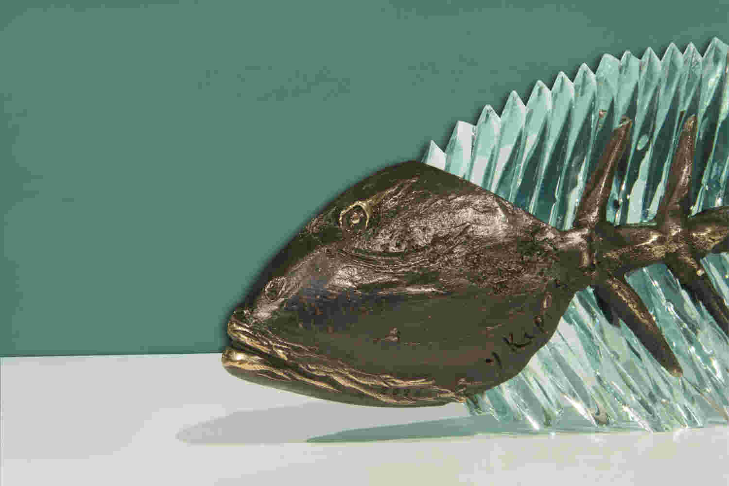 Cast bronze & glass sculpture of a fish. “Frozen Fish”.